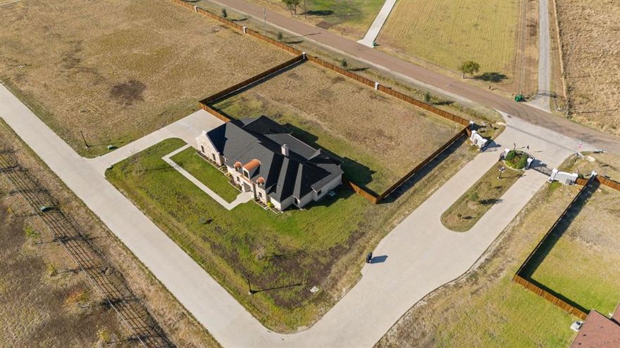 BUILDER WILL BUY DOWN THE INTEREST RATE TO 5.375%!!! EXQUISITE COUNTRY LIVING AT ITS FINEST! This DREAM property sits on an ACRE LOT in a luxurious GATED EQUESTRIAN COMMUNITY with NO CITY TAXES! This community has so much to offer*STOCKED Catch & Release POND, STABLES FOR BOARDING the HORSES, PLAYGROUND, 3 MILE RIDING TRAIL, ARENA, ROUND PIN, FULL SERVICE EQUESTRIAN CENTER & THE LIST CONTINUES*This MASTER PLANNED community is located just 35 minutes from Dallas & will have additional AMENITIES added*BEAUTIFUL SPACIOUS OPEN FLOOR PLAN with so much ATTENTION TO DETAIL & all the BELLS & WHISTLES with all the Right Space*QUALITY NEW CONSTRUCTION with numerous STUNNING ARCHITECTURAL DETAILS like ARCHWAYS, 8 FT WOOD DOORS, Tons of TRIM WORK, Tons of SOFT CLOSE CABINTERY THROUGHOUT, DESK WORKSTATION in the Hallway, UPGRADED CLOSETS With SHELVING, BUILT IN SHELVING in the LIVING ROOM with GOURGEOUS HARDWOOD FLOORS, lots of Windows to let the sunlight in & an IMPRESSIVE WOOD BURNING FLOOR TO CEILING FIREPLACE*UNBELIEVABLE CHEFS GOURMET OVERSIZED ISLAND KITCHEN with tons of CABINETRY with Lighting, REMARKABLE QUARTZ COUNTERTOPS, UPGRADED APPLIANCES, POT FILLER & a HIDDEN PANTRY*ELEGANT MASSIVE PRIMARY BEDROOM WITH AN OFFICE & A HUGE SPA LIKE MASTER BATH with HIS & HER VANITIES, FREE STANDING TUB, INCREDIBLE SHOWER & a WALK-IN CLOSET TO DIE FOR*Great for entertaining with a FORMAL DINING & BREAKFAST AREA*SPACIOUS SPLIT BEDROOMS for Maximum Privacy*PRIVATE GUEST BEDROOM with ENSUITE BATH*LARGE GAMEROOM bumps into the MEDIA ROOM complete with BUILT IN SPEAKERS ready for all your movie nights with friends & family*ATTRACTIVE Laundry Room with Extra Cabinetry & a Sink*MUDROOM located off the OVERSIZED 3 CAR GARAGE*TWO Entrances into the Community*Welcome to this PRESTIGIOUS COMMUNITY, get excited to call this your new home, where you can experience LUXURY, TOP OF THE LINE AMENITIES, QUALITY CONSTRUCTION, RELAXED COUNTRY LIFESTYLE, SUNRISES & SUNSETS, a PRICELESS EXPERIENCE!!!