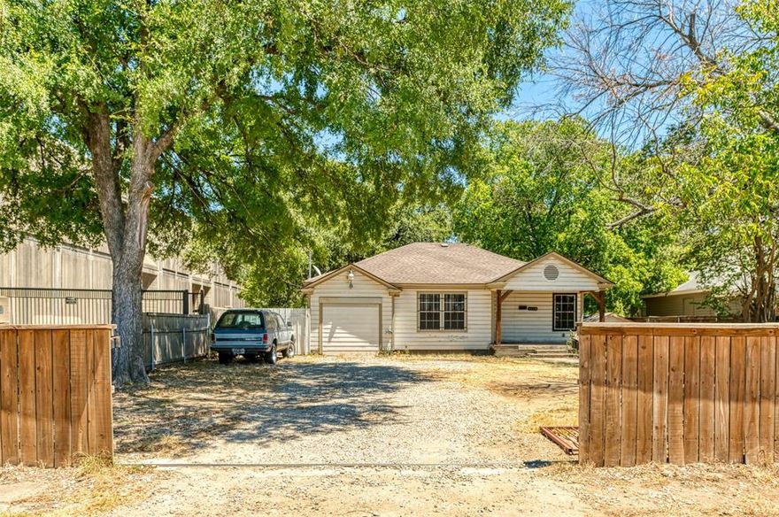 Multiple offers received! Deadline to submit is 8-24 at 5:00 pm. Amazing opportunity to own a cute home on a rare half acre lot! 3 bedroom 2 bath home with stylish Front Porch that has been upgraded with cedar columns and tile entrance!  Kitchen has lovely cabinets and granite countertops with backsplash. Living area has Gorgeous ceiling with can lights plus decorative lighting! Original hardwoods throughout the home! Baths have been remodeled and a have beautiful tile! Nice sliding gate to backyard where you will have plenty of room to play, build and create lasting memories! There is also an elementary school being built on the street! This is a great opportunity to own a wonderful home with a rare amount of land. Hurry before it is gone!