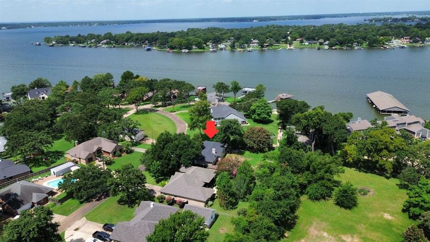 Want that Lake Life with out the Lake Price??? Welcome to Spanish Shores! The highly sought after, well established, gated community has a new listing! Come check out the beautiful 118 Guadalupe Drive with a fantastic lake view and towering shade trees. Perfect as a starter home or for someone looking to downsize. The primary bedroom has sliding glass doors leading to the screened in back patio as well as a private ensuite with a walk in closet, soaker tub and walk in shower. The second bedroom has a generous sized closet as well as direct access to the second full bathroom. Tile flooring throughout, stainless steel appliances and granite countertops all updated in 2019 as well as the roof and AC replaced. Large fenced back yard for the furbabies or kids to play with sprinkler system to keep the grass healthy and green all summer. 
Come check out all that 118 has to offer such as access to the neighborhood boat ramp and quick drive to all the shopping, restaurants and entertainment located in Gun Barrel City. Such a good find for the ready to move in buyer that's not looking to do any kind of repairs or updates. It's all been done for you!