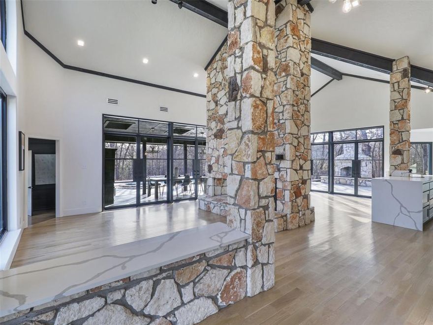 Great price for this retreat in Denton Co., Bartonville ETJ, NO CITY TAXES, NO HOA! Finance avail as Conv. residential. Opportunities to fully utilize this property are endless with 6 multi-use living & dining spaces, lg. commercial kitchen, 7 rms. have en-suite baths. This 5+ ac estate offers a haven of rest & retreat! Designed to capture the beauty of nature with soaring walls of steel windows & exterior-swing doors that bring the feel of outdoors in,  Floorplan combines leisure & functionality. The owner-property mgr. suite has private living space, office, sauna, fireplace & offers private entry & view to the resort style setting & wooded forest backdrop with swimming pool-spa, outdoor shower, picnic areas, outdoor kitchen, multiple patios & pavilion style areas, guest quarters and a HVAC gym-sized area with epoxy floor, making it ideal for a health fitness area, show-garage or event area. Redesigned & completely renovated for today’s in-home on-site business owners, in-home education, retreat & conference spaces