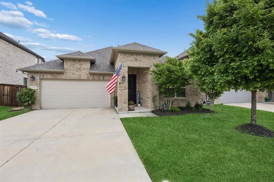 Welcome to 10324 Lakemont Dr, a well-appointed single-story home offering 3 bedrooms, 2 bathrooms, and approximately 1,998 square feet of thoughtfully designed living space built in 2021. This property stands out for its seamless blend of comfort, function, and location, appealing to buyers searching for a move-in ready home with modern upgrades and strong community amenities. A welcoming entry introduces a flexible front hallway with secondary bedrooms positioned for privacy, while the open-concept living, dining, and kitchen areas create a natural gathering space enhanced by elevated ceilings, abundant natural light, and a warm, inviting fireplace. The kitchen is designed for both everyday use and entertaining, featuring generous cabinetry, durable countertops, stainless steel appliances, and a large island that anchors the space and supports casual seating. Recent improvements elevate both style and efficiency, including a custom steel front door from Love That Door, a steel insulated garage door with beltdrive Bluetooth opener, overhead garage storage racking, and programmable Jellyfish eave lighting with thousands of color options for year-round accent or holiday display. Custom rock and flagstone pavers along the sides of the home add distinctive curb appeal and functional outdoor pathways. The backyard offers a unique advantage with no rear neighbors, backing to an expansive greenbelt that enhances privacy and open views. Outdoor features include a gas fire pit and a patio plumbed for a grill connection, ideal for entertaining or relaxing. Residents benefit from convenient access routes with no rail crossings, proximity to grocery stores, stocked ponds, and miles of walking paths throughout the community. A nearby community center with a swimming pool further contributes to the overall appeal and lifestyle convenience. This home delivers a compelling combination of location, upgrades, and livability for today’s buyer.