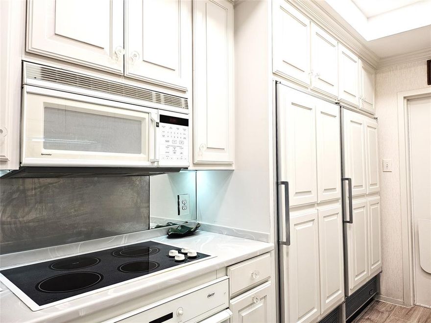 Spacious bright quiet corner unit with expansive views of Preston Hollow and beyond. Floor to ceiling walls of windows.  Three en-suite bedrooms, office space, wet bar, powder room.  Custom mirrored walls & built-in cabinets.  The kitchen features sub-zero refrigerator, separate sub-zero freezer, Asko washer, dryer, pantry area, and a service entrance.  Quick access to restaurants & NorthPark Center.  HOA fees include all utilities, fast speed internet, basic cable, HVAC maintenance & filter changes, 24 hr front desk security, concierge services, gym, heated salt-water indoor pool, and bldg maintenance & bldg insurance.  No pets or smoking allowed.  True carefree lock & leave lifestyle.  Up to 2 assigned parking spaces per unit.  Small storage in the basement.  All measurements are approximate and should be verified by Buyer. The seller has TX real estate license.