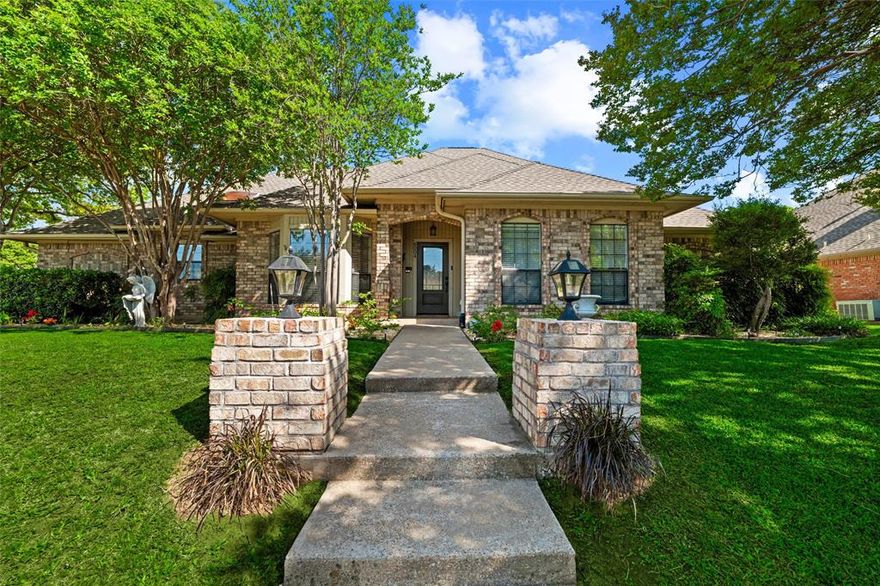 Welcome to prestigious Waterwood Estates! Established, Secluded and Tranquil living with NO HOA! Enjoy scenic tree-lined streets, well maintained homes, gentle rolling hills, and a short walk to Lake Arlington and Richard Simpson Park. This hidden gem sits on an interior corner lot with lush landscaping, full sprinklers, newer roof and gutters, private backyard, oversized 2 car garage and 3-car parking pad. Home blends timeless 1980s architecture with contemporary touches. Neutral tones, spacious rooms, and a flexible layout suited to a variety of lifestyles. 4 generously sized bedrooms (2 down, including primary, 2 up), spacious game room up ideal for teens or guests offering both comfort and versatility.
Inside, you’ll find 3 living areas, 2 fireplaces, a bright sunroom, a walk-out balcony with spiral staircase, abundant storage, and a private, pet-friendly backyard. The main living room welcomes you with a cozy fireplace and seamless flow, while a concealed staircase and catwalk provide a unique architectural touch—perfect for showcasing art. The formal dining room connects effortlessly to the chef’s kitchen, the true heart of the home--include Abundant natural light, Brick-accented cooking area, Double stainless oven, Oversized island, Extensive cabinetry, built-ins, and wide drawers, Custom pantry with hidden lazy Susan, Breakfast nook with scenic views. The spacious family room_den features hardwood floors, a large bay window seat, and a full wet bar—ideal for entertaining. Additional conveniences include direct garage access, a separate laundry room, and a guest powder bath.
The primary suite is impressive in size and comfort, a cozy brick fireplace, sitting area, sunroom access, and serene backyard views. The en-suite offers Dual Vanities, Granite Countertops and Seating area, Separate Shower, Jetted Tub, Skylight—Expansive walk-in closet_ built-ins. 
This exceptional property combines character, space, and location—Must See! SOME IMAGES VIRTUALLY STAGED.