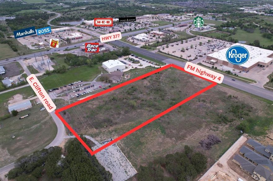 Prime commercial development opportunity in one of Granbury’s fastest-growing corridors. This 4.382-acre unimproved lot is located just one block south of the high-traffic intersection of Highway 377 and FM 4, offering dual access with direct frontage on FM Highway 4 and rear access from East Clifton Road. This configuration provides excellent entry and exit flexibility for future commercial development.

The property measures approximately 600 feet deep and 525 feet wide, featuring a 30-plus foot elevation change from the northwest corner to the southeast corner. This unique topography presents creative design opportunities for elevated views and standout site planning. A recently installed city water main and fire hydrant run along the eastern boundary, offering added utility value and eliminating infrastructure setup concerns.

Currently zoned HC (Heavy Commercial), the land is well-suited for retail, office, medical, restaurant, or service-based development. The zoning could also be revised to meet the needs of your specific project. With very few trees on-site, developers will benefit from significantly reduced tree mitigation costs—saving time and money during the preparation phase.

Located on the Fort Worth side of Granbury, this lot is just 400 yards from Highway 377, offering high visibility and exposure to daily traffic. It is also close to major national retailers and dining including HEB, Kroger, Starbucks, and the vibrant Luton Ranch shopping center. This area is experiencing rapid commercial expansion and increased consumer demand, making it an ideal location for long-term investment or business growth.

With exceptional location advantages, dual road access, and public utilities already in place, this property is a rare opportunity to secure prime commercial land in one of the most desirable and high-traffic areas of Hood County.
