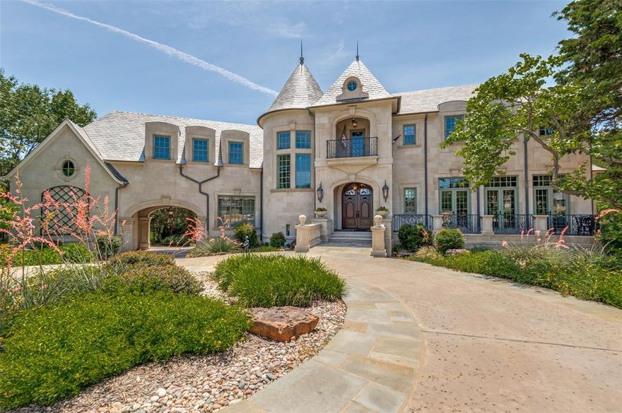 A Hilltop Masterpiece with Unmatched Views of the Entire DFW Skyline. Welcome to one of Cedar Hill’s most iconic estates — a breathtaking luxury custom home perched high above the Metroplex with panoramic views of Joe Pool Lake and beyond. This architectural gem spans over 7,000 square feet across 3.5 stories, offering a rare blend of elegance, privacy, and lifestyle. Set on more than 3 acres in a prestigious gated community — with an additional private gate and circular drive — this home is a sanctuary like no other. Step inside to discover 5 spacious bedrooms, 5 full and 2 half baths, a true wine cellar, and luxury finishes at every turn. The home also features a private elevator that accesses three floors, ensuring convenience and comfort for all. The mother-in-law suite with a private laundry is ideal for multi-generational living or extended guests. Outside, entertain in style with a resort-style infinity edge pool, two hot tubs, and a fully-equipped cabana — all positioned to capture jaw-dropping sunsets and city lights. Golf lovers will enjoy their own 2-hole course, while nature lovers will appreciate the custom stream and pond, beautifully designed to welcome your guests in unforgettable fashion. A private office with balcony overlooks the city skyline, creating the perfect blend of work and inspiration. The custom limestone exterior, slate roof, and impeccable craftsmanship throughout add to the home’s timeless elegance. Located just minutes from Joe Pool Lake, Tangle Ridge Golf Course, and miles of scenic trails, this one-of-a-kind estate offers both serenity and convenience. Truly a must-see — schedule your private tour today. Homes like this simply don’t come around often.