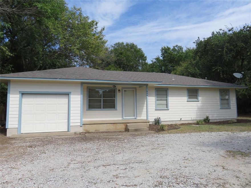 This delightful 3 bedroom 1.5 bath home is conveniently located in between Pottsboro High School and Pottsboro elementary and middle schools, and close to Highway 75 and Highway 289.  The home has been updated with vinyl plank floors throughout, granite countertops and sinks in the kitchen and bathrooms, fresh paint throughout the inside and outside, and an HVAC system less than one year ago.  The hall bathroom has a tub and shower combo PLUS a separate shower.  You will enjoy plenty of storage space with hall cabinets and a hall closet, plus walk in closets in two of the bedrooms.  The fenced backyard is very spacious and features a covered deck for relaxing and enjoying the outdoors.  The home has an attached one car garage and a large utility room that connects the garage to the inside of the home.  Don't wait on this one - take a look today!  Pets on a case by case basis.