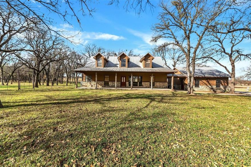 Beautiful gated home in the well sought out Wise County. Minutes away from Hwy 287 and 30 minutes from the metroplex. This stunning 6.58 acres has plenty of trees and open space. Enjoy sitting on your back covered porch with the peaceful country views. This 3 BR 2.1 bath has so much to offer. Cozy living room has a big WBFP. Large pond on property. Huge shop with living quarters inside. Shop also has an outdoor kitchen.