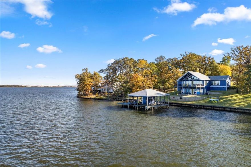 Step into your very own waterfront oasis at Thunderbird Point! This stunning 4-bedroom, 4-bathroom house is the perfect blend of relaxation and recreation. Situated on a beautiful lot and boasting an impressive 175 feet of waterfront, this property offers incredible panoramic views that will take your breath away.

Imagine waking up to the sight of the sun rising over the water or enjoying dinner with loved ones while taking in the incredible sunset views. Step inside and be captivated by the open concept design that seamlessly blends the dining, living, and kitchen areas. Every room boasts incredible views of the tranquil waters, creating a sense of serenity and tranquility throughout the home. Picture yourself waking up to the gentle lapping of waves and enjoying your morning coffee as the sun dances on the water.

For those who love outdoor living, an expansive balcony awaits you, providing the perfect spot for al fresco dining or relaxing with a good book. And let's not forget about the oversized boathouse! The covered sitting area and party deck add extra charm and convenience, allowing you to fully embrace the joys of waterfront living.

Gather around the oversized fire pit for cozy evenings under the stars or take a dip beside the large boat house and swimming area with convenient steps for easy access on hot summer days. With deep open water just steps away, you'll have plenty of room to enjoy endless days of aquatic adventures.

If you've been dreaming of owning a waterfront retreat where you can unwind and create lasting memories, this property is truly a gem. Don't miss out on this opportunity to make it yours. Contact us today to schedule a showing!

*This home also comes with an additional lot for boat storage. It is not on the property but is in Thunderbird Point: County Road 2619, Property ID 10612