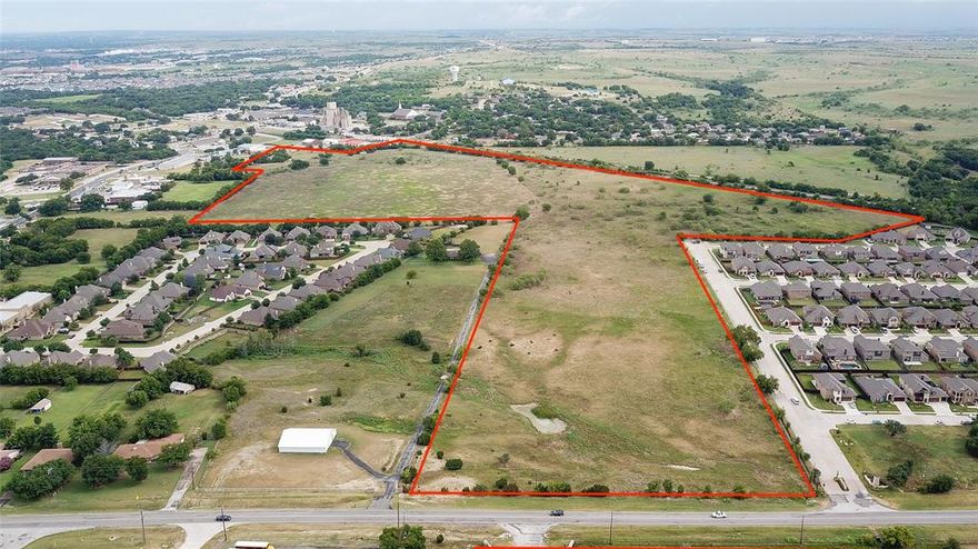 Excellent opportunity to purchase one of the last large tracts in near downtown Aledo. Currently AG exempt and zoned light industrial. Perfect development opportunity. Would be a great mixed-use development of commercial by the traffic areas, light industrial by the tracks and all forms of residential in between. Small house on property is vacant. Three parcel id's for this property. R000090879 is 58.604 acres, R000051889 is the old 1 acre homestead and R000000171 is .56 acre. So much potential with this property.