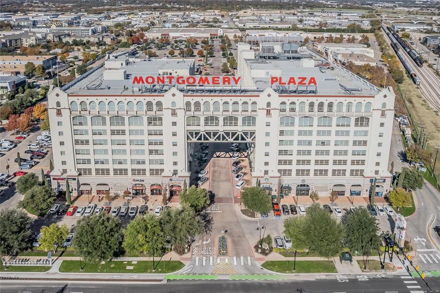 Hi there, I’m 2600 W 7th #1315, and trust me—you’re going to want to know me. I’m perched on the 3rd floor of the coveted West Tower at Montgomery Plaza, and while that may not sound like a big deal at first, it’s everything. Why? Because I’m just steps away from the most legendary pool scene in Fort Worth (trust me, you’ll thank me when you’re not juggling snacks and sunscreen through the elevator maze).  But don’t worry—I also know how to do quiet luxury. I’m tucked into a private back corner, so when you’re ready to unwind, it’s all peace, privacy, and skyline views. Inside, my 17-foot ceilings, sun-soaked windows, and open floor plan make me feel more like a penthouse than a condo. My owners have impeccable taste, so you’ll find thoughtful upgrades everywhere—from motorized blinds and an electric fireplace with a bold painted geometric accent wall to that half bath wallpaper moment everyone ends up talking about.  Now, let’s talk about my favorite feature: the Party Button. One tap and I spring to life—lights up, shades rise, and music starts. Hosting just got a whole lot easier.  I come with two spacious bedrooms, two and a half bathrooms, and two deeded pie-shaped parking spaces side by side—because yes, even your cars deserve a little breathing room.  And let’s not forget my address perks.  I come with a 24-hour concierge who’s always ready to help, plus all the best amenities — a resort-style one-acre rooftop pool deck with cabanas, spa, fire pits, fitness center, and private movie theater — all right down the hall on the 3rd floor of the West Tower. Trust me, having everything that close is a serious game-changer.  Feeling nostalgic? Walk to shopping, dining, museums, and the Trinity River Trails. And for my fellow Frogs — I’m just a quick hop from TCU. Oh, and fun fact—one of my owners was an Air Force pilot, so check out the incredible memorabilia before it takes flight.  Modern. Playful. Iconic. I’m ready for my next adventure — could it be with you?