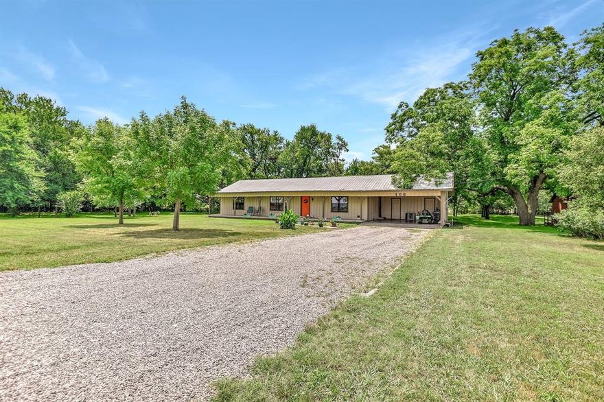 Come escape from it all in this great country home. The beautiful trees that line the property gives you that privacy you are looking for. You can sit out on the big front porch that runs the length of the house and enjoy the peace. The open floor plan gives you that flexibility to make the space your own. Some of the wonderful features include a pellet stove for a great heat source, an on suite half bath in the master, spacious open kitchen and dining area, large living area and spacious secondary bedrooms. The kitchen features oven, stove top and built in microwave. The acre of land features tons of mature trees, a creek that lines the back of the property, a big metal storage building for all the tools and great extra storage.