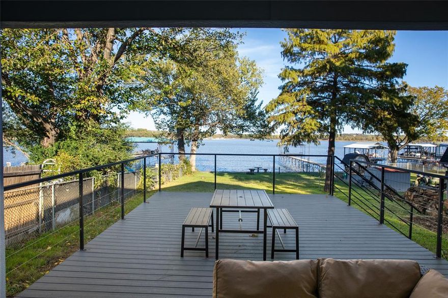 What a beautiful Lake House and so close to downtown Fort Worth! Newly built home in 2022. Currently furnished and used as a vacation rental. Lots of cool features in the home. Vaulted ceilings. Very open floor plan. Huge Kitchen with custom cabinets, quartz counters, big island, and pot filler. Stainless appliances. Nice windows over the sink looking at the lake. What a view! Living room is comfortable with flat screen wired in above electric fire place. 3 bedrooms all a good size. Master has an amazing view of the sunrise. Master bath with walk in shower and walk in closet. Spare bath with tile shower bath combo and utility closet setup with stackable washer dryer. Huge deck partially covered with outside TV and fireplace. Great place to enjoy the shaded evenings. Quiet neighbors. Huge backyard with plenty of room for entertainment. Not much in the water for sale. See this before its gone!