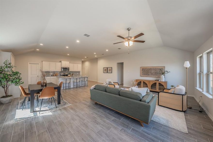 *OPEN HOUSE SATURDAY, MARCH 14TH, FROM 2 - 4 PM* Stunning, like-new Impression home just minutes from Marine Creek and Eagle Mountain Lake! As you arrive, you’ll immediately appreciate the striking brick and stone exterior that creates beautiful curb appeal. Step inside to soaring ceilings and elegant wood-look tile flooring that guide you seamlessly into the heart of the home. The open-concept design features an oversized kitchen and expansive living area ideal for entertaining. The kitchen showcases crisp white cabinetry, subway tile backsplash, gorgeous granite countertops, a center island, and a spacious walk-in pantry. The living room overlooks the backyard and offers a serene, nature-filled backdrop with large mature trees behind the home. The primary suite is thoughtfully designed with a spa-like bath featuring dual sinks, a large shower, and a walk-in closet. Secondary bedrooms are privately split from the primary and share a full bath. Conveniently located minutes from shopping, schools, and entertainment - this exceptional home is priced to sell and completely turn key! Please verify all data including HOA dues.