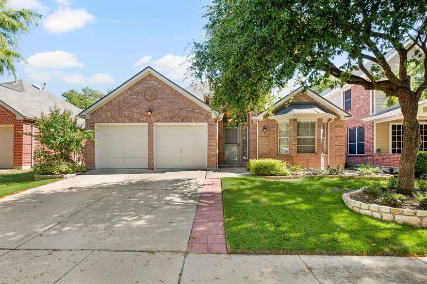 Beautiful single-story home in the highly sought-after Heritage community in Fort Worth! This inviting residence offers 3 spacious bedrooms, 2 full baths, 2 dining areas & 2 living spaces that are perfect for both entertaining & relaxing. Nestled on a picturesque tree-lined street, the home features laminate & ceramic tile flooring throughout (no carpet), updated bathrooms & a comfortable, open layout designed for modern living. The kitchen is a highlight, featuring stainless steel appliances, granite countertops, a large island & a breakfast bar that opens seamlessly to the living area that is ideal for gatherings & casual meals. From the kitchen, enjoy a beautiful view of the backyard, creating a warm, inviting atmosphere for cooking & connection. The backyard offers a peaceful, private retreat with mature trees, a garden area &  fruit trees including a fig tree & a loquat tree which is perfect for anyone who enjoys outdoor living & nature. The home also includes ramps inside the garage & easy backyard access for wheelchair accessibility. Heritage is one of Fort Worth’s premier master-planned neighborhoods, offering resort-style amenities including multiple pools, splash pads, tennis & volleyball courts, playgrounds & walking trails. With a friendly community atmosphere & convenient access to shopping, dining & major highways, this home truly combines comfort, style & location.