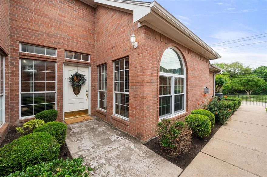 Fresh paint, new luxury vinyl flooring throughout, and a new roof make this townhouse-style home move-in ready. With 3 bedrooms and 2 full baths, the layout offers flexibility, including one bedroom with French doors that works beautifully as a home office. You will also find a full-size formal dining room, large bedrooms, a small side porch, and rear-entry alley access to the 2-car garage. Nestled in a small, quiet community where homes do not come up for sale often, this property is a rare find in the highly sought-after Mansfield High School area.