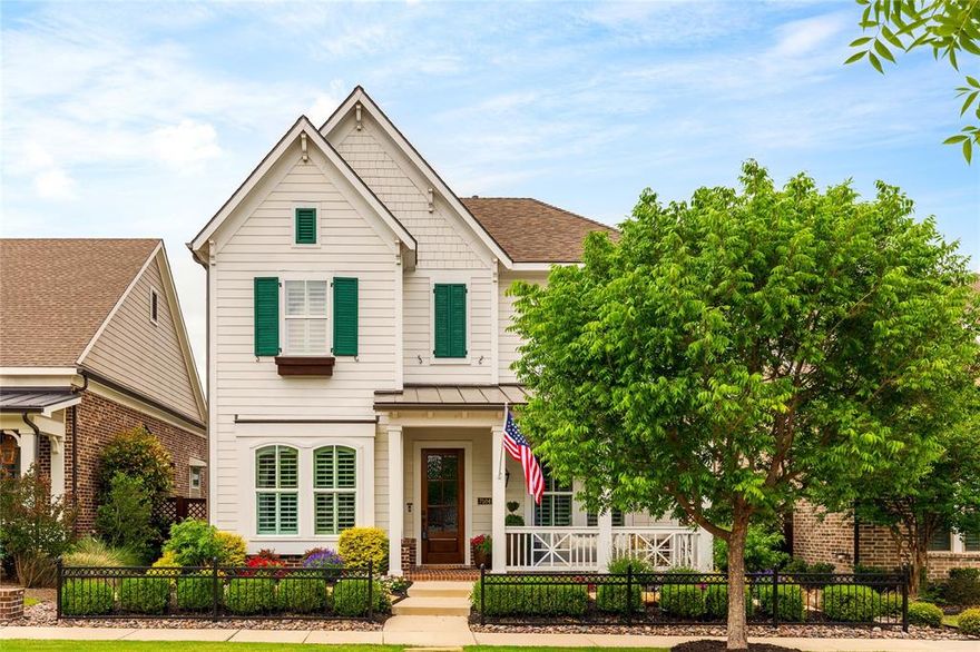 Located on a quiet interior lot in McKinney’s highly desired front-porch living community of Tucker Hill, this exceptional home blends timeless charm with thoughtful modern upgrades. Beautiful curb appeal welcomes you home, highlighted by a large, inviting front porch designed for gathering and relaxing, complete with a charming hanging daybed swing and custom gas lantern that embodies the neighborhood’s signature lifestyle.
The home is loaded with over $100,000 in upgrades, from designer decorative lighting to a Class IV impact-resistant roof. A comprehensive list of enhancements is available, reflecting the care and investment poured into every detail. The entertaining, open-concept floor plan is filled with natural light and enhanced by handsome millwork that adds character and warmth throughout.
The chef-inspired kitchen anchors the main living area and features a large gathering island, gas range, and ample workspace, making it ideal for both everyday living and hosting guests. Adjacent formal dining showcases built-in cabinetry, offering both elegance and functionality for memorable meals and celebrations.
The primary suite is conveniently located on the first floor, providing a private retreat with comfort and ease. Upstairs, three additional bedrooms are complemented by an expansive game room, offering flexible space for recreation, media, or work-from-home needs.
Step outside to a beautifully curated backyard oasis, where a serene fountain creates a peaceful setting for outdoor enjoyment. Completing the home is a two-car garage with an additional workshop area, perfect for hobbies, storage, or projects.
This Tucker Hill residence offers refined living, thoughtful design, and an unmatched sense of community—all in one of McKinney’s most sought-after neighborhoods. Prosper ISD. Move in ready!