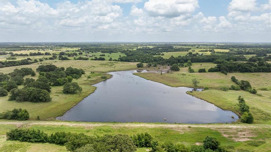 We are pleased to present an exceptional opportunity: a plus or minus 640-acre tract of land situated along VZ County Rd 2705 in Van Zandt County, TX, located near the growing community of Mabank. There is an 8 in. water line along VZ CR 2705 in which the City of Mabank has tentatively approved adequate supply for a new project. The city of Mabank will need to be contacted for details regarding final approval.. This expansive property offers nearly a mile of direct road frontage, ensuring convenient access for large-scale projects, and features a diverse topography that includes rolling hills, expansive pastures, mature woodlands, and natural water features, including two large 9 and 4 acre stocked tanks—offering both aesthetic appeal and functional versatility for multiple uses.

The varied terrain, with its gentle elevation changes, provides multiple opportunities for master-planned communities, company hunting getaways, luxury estates, or mixed-use developments, with potential home sites offering scenic views of the surrounding countryside. The property’s open fields are well-suited for agricultural or recreational components, while the wooded areas and water features enhance its appeal for eco-friendly or leisure-focused projects. Its proximity to Mabank positions it within a region experiencing steady growth, with convenient access to US-175 facilitating connectivity to Dallas and the recreational amenities of Cedar Creek Lake, a popular destination for boating and fishing.

This parcel is ideally suited for developers seeking to capitalize on the increasing demand for rural yet accessible properties in East Texas. The substantial acreage allows for flexible zoning possibilities, whether for residential subdivisions, commercial ventures, or a private retreat, all within an hour of Downtown Dallas. Infrastructure considerations, including water, electric, and septic options, should be verified to align with development plans.