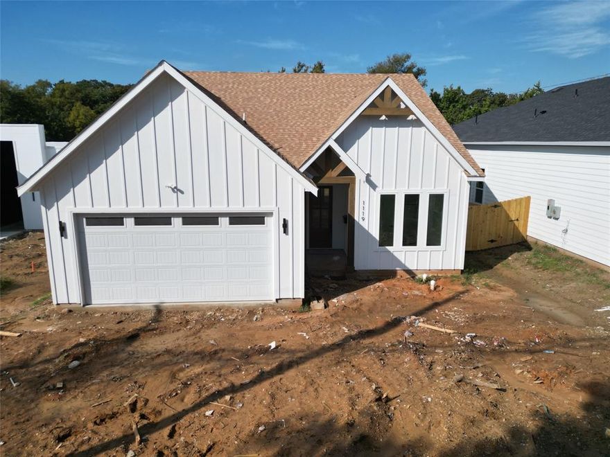 Stunning Modern New Construction offering over 2,300 SQ FT of elevated living. This beautifully designed 4-bedroom, 2-bath home delivers the perfect blend of modern architecture, comfort, and functionality.  Upon entry, you'll find an extended foyer with soaring ceilings, warm wood flooring, abundant natural light, and an open concept layout that seamlessly connects the kitchen, dining, and living spaces. The chef-inspired kitchen boasts beautiful modern cabinetry, quartz countertops and premium appliances.  Spa-style bathrooms feature floating vanities, designer tilework, a sunken tub and modern wall-mounted fixtures that highlight the home’s sophisticated aesthetic. The spacious primary suite provides a serene retreat with a luxurious en-suite bath and closet system for convenience and organization.
Outside, enjoy a huge backyard, this homesite sits on an oversized .33 acre lot that backs to a heavily wooded treeline backdrop—offering privacy, shade, and the perfect setting for outdoor living and family gatherings. Modern design, clean lines, and refined finishes make this home a standout new construction opportunity.  Estimated completion: Don’t miss the opportunity to own this modern Dallas masterpiece!