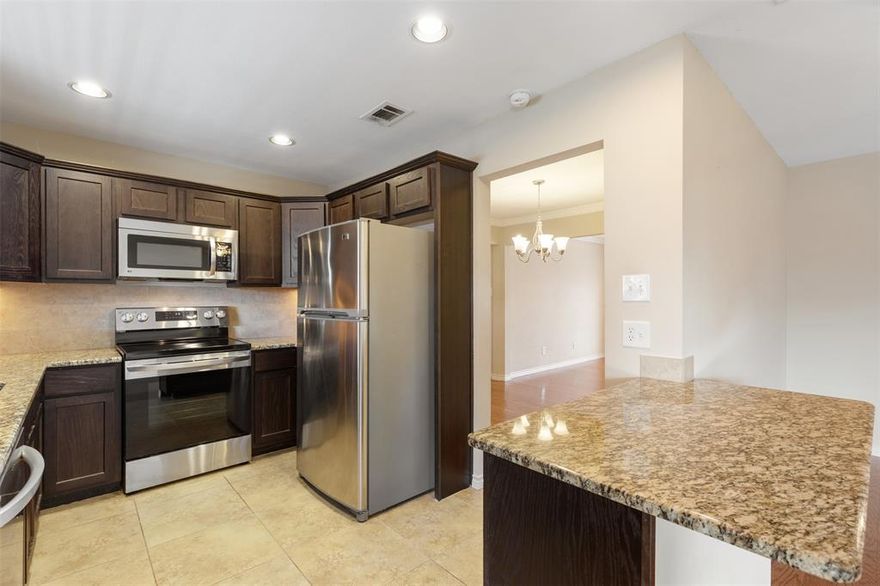 Discover this spacious and well-appointed two-bedroom, two-bath second-floor condo featuring a desirable split-bedroom layout—ideal for roommates, guests, or a flexible home office setup. A major perk: HOA dues cover all utilities except internet and cable, helping keep monthly costs predictable and eliminating worries about soaring summer electric bills. Inside, you’ll find two generous living areas that offer plenty of room for relaxing, entertaining, or working from home. The updated kitchen is both functional and stylish, featuring granite countertops, stainless steel appliances, a large pantry, and ample storage, making it perfect for everyday living and hosting. The primary suite is a true retreat with a spacious bedroom, an updated ensuite bath, and three closets providing exceptional storage. Durable, modern LVP flooring runs through the main living areas, adding warmth and low-maintenance appeal. Step outside to the large private balcony, an inviting space for morning coffee, evening gatherings, or simply unwinding outdoors. Additional highlights include two covered parking spaces, a community pool, and well-maintained common areas. Ideally located near Central Market, SMU, Mockingbird Station, White Rock Lake, and nearby trails, this condo offers easy access to shopping, dining, outdoor recreation, and vibrant city living. Move-in ready and exceptionally located, this is a fantastic opportunity to own in the heart of Dallas.