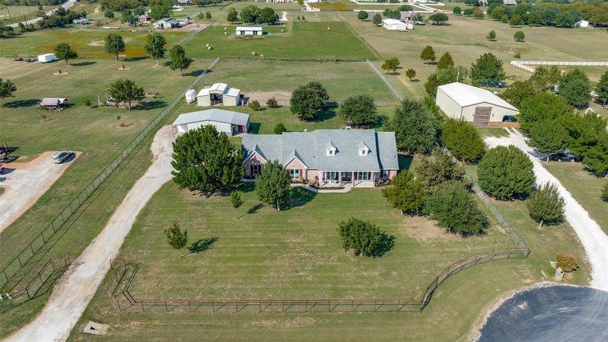 This prime 2-acre horse property has it all! Fully cross-fenced with durable pipe fencing, it’s ready for your animals and includes a 3-stall barn. In addition to the 2 car garage, the 30x50 shop with electricity provides ample workspace and storage. Your outdoor space is complete with a fire pit, fresh landscaping, mature trees in both the front and back yards, spacious front porch, and covered back patio make it perfect for everyday living and entertaining. Inside, enjoy a freshly updated feel with interior paint completed this year and no carpet throughout! The 4-bedroom open floor plan features a wood-burning fireplace in the living room, an island kitchen with granite countertops, double oven, and oversized walk-in pantry. The private primary suite offers a separate shower, garden tub, and dual sinks. With no HOA, plenty of space for horses, extra workspace, and room to spread out, this property blends country living with modern amenities. Back on market due to buyer's change in circumstance.