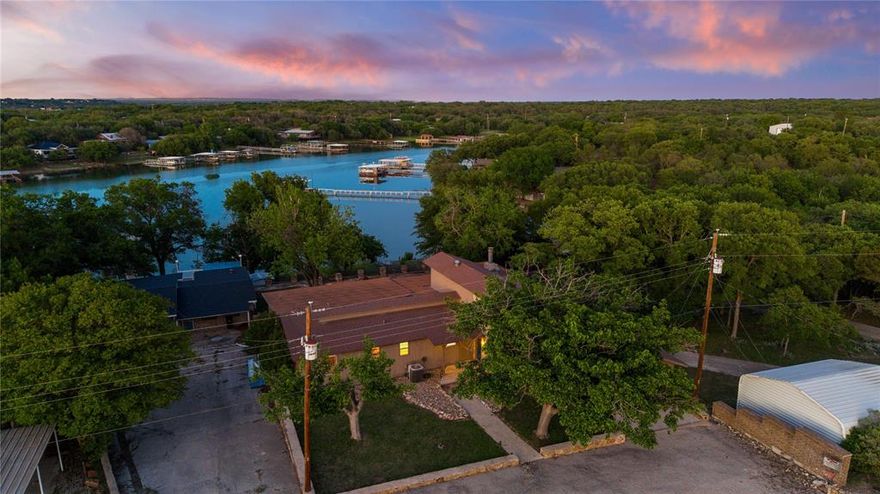 Escape to lakeside luxury with this stunning 4-bedroom, 3.5-bath waterfront home located in the Cason Cove area of beautiful Lake Brownwood, Texas. Nestled on a spacious lot with serene lake frontage, this beautifully designed home offers the perfect blend of comfort and style. Inside, enjoy an open-concept living area, large kitchen with tile countertops, a large breakfast bar and a wall of windows that frame breathtaking water views. The primary suite features an ensuite bath and another wall of windows overlooking the lake. The fun room is upstairs which has 3 bunkbeds to stack those grandkids with room to play. Ideal for entertaining, the home boasts split level living to dining areas, multiple outdoor spaces from the large grassy area following steps down the waterfront level. A private dock extends into the cove with 10.5 ft. water depth at spillway level—perfect for swimming, fishing, or docking your boat. Tired of skiing? This property is only 2 miles from The Hideout Golf Club & Resort, a hidden jewel in central Texas ready to provide you with entertainment. Whether you’re looking for a weekend getaway or a full-time retreat, this property delivers peaceful lake living just minutes from town. Don’t miss the chance to own your own slice of waterfront paradise!
