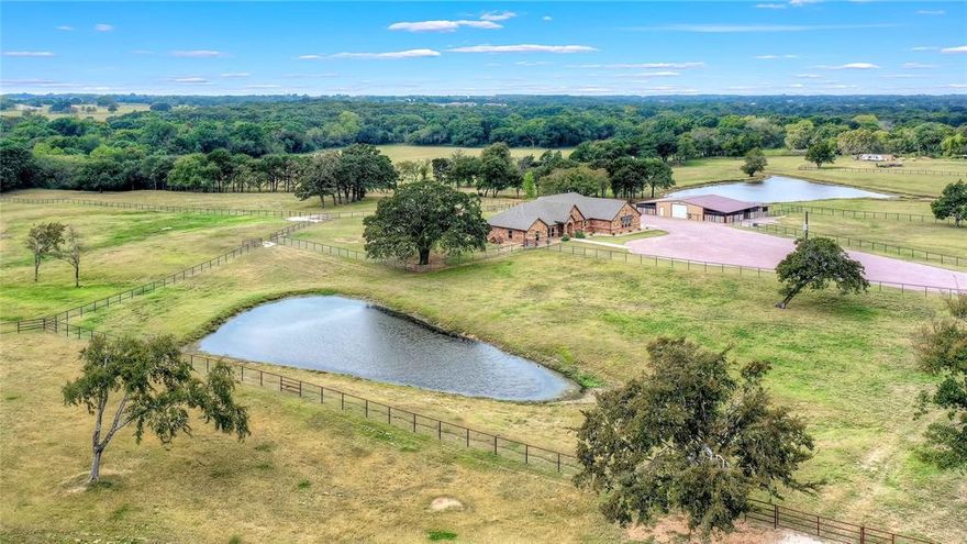 Incredible private, country estate on 30 acres suitable for horses or cattle. Custom home with pool, improved pastures, large oak trees and coveted sandy soil so critical for horses. The 2,636 SF Cashon home has 3-bedrooms, 3-baths, an open floor plan and numerous custom touches. The living and dining areas greet you upon entry. The split bedroom floor plan ensures privacy. The primary ensuite bath has a jetted tub, separate shower, dual vanities and a large walk-in closet.  A large 2nd bedroom has its own ensuite bath. Granite countertops, stainless appliances, a wine cooler, convection oven and microwave grace the well designed kitchen. French doors off the living area lead to a private saltwater pool and spa and the fenced back yard. 9 cross-fenced pastures have pipe and no-climb fencing. The 7-stall barn with storage, 130'x250' outdoor arena with reining footing and a storm shelter rounds out the facilities. Conveniently located to DFW and OKC. A lifestyle to be envied-come see it!
