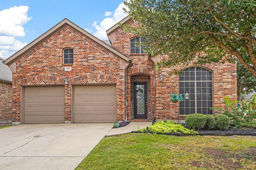 Corner lot home in the desirable Woodcreek Fate community designed for both comfort and luxury. Featuring 4 bedrooms and 3.5 baths, it offers an inviting living space with a brick and stone fireplace, formal living and dining rooms perfect for entertaining, plus a game room and media room for endless fun. The eat-in kitchen boasts granite countertops, a large island, and stainless steel appliances, including a gas range. The owner's suite includes a spa-like ensuite with soaking tub, dual vanities, a separate shower, and a spacious walk-in closet. A half bath on the main floor adds convenience. Upstairs, two secondary bedrooms share a Jack & Jill bath, while a guest suite enjoys a full bath. Outside, enjoy the private, landscaped yard with an extended covered stone patio and cozy fire pit. Minutes from shopping, dining, and community amenities in Fate and Rockwall!