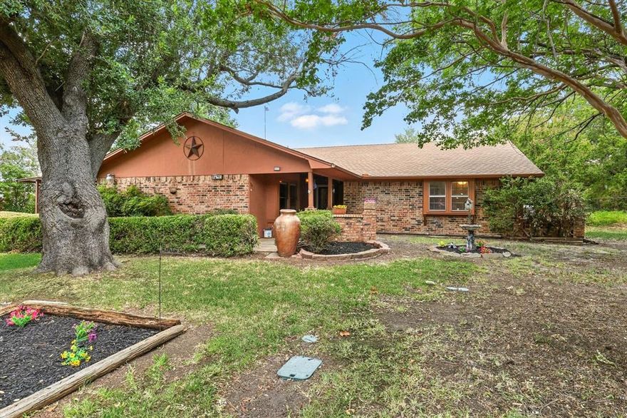 Jan 2026 Updates!! Bathroom countertops, sinks, faucets and mirrors! No HOA, No MUD, No PID!! Close to schools. Over half acre lot, the road is a cul de sac. Lovingly maintained by original owner, this home isn’t just a property, it’s a place with space to live, work, and dream with a touch of nostalgia! Step inside to find vaulted ceilings in the living room that invite natural light and a brick fireplace to create a warm, open feel. Enjoy your morning coffee in the window-wrapped enclosed sunporch. The converted garage now serves as a generous family room with its own walk-in closet, perfect for game nights, hobbies, or simply gathering with the people you love. The primary ensuite offers the comfort of split vanities and dual walk-in closets, while each bedroom has been refreshed with new carpet; bedrooms, halls and bathrooms offer updated ceiling texture, and a coat of fresh paint—making every space feel new again.

But the real magic is outside! Two-story, 30x40, 6-car garage on a concrete slab with electric, attic fan, three bay doors, drive-through access, and a fully decked second floor with shelving for everything you need to store and organize. A detached two-level workshop with electric is ready for your biggest projects, while a separate detached office with electric, window AC, and three storage bays is ideal for running a business, creating art, or simply having a space that’s all your own. The detached shed with windows on three sides & wired for a hot tub, complete with a ceiling fan, adds a touch of relaxation and retreat or could be used as a greenhouse-garden shed for those with a green thumb.

All of this secured behind an electric iron gate for security and peace of mind. This is more than a home. It’s a workshop, a retreat, a gathering place, and a launchpad for your next chapter. Whether you’re a hobbyist, a small business owner, or someone who simply dreams big, this property offers the room, and the inspiration, to make it happen!