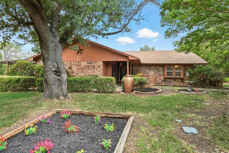 No HOA, No MUD, No PID!! Close to schools. Over half acre lot, the road is a cul de sac. Lovingly maintained by original owner, this home isn’t just a property, it’s a place with space to live, work, and dream with a touch of nostalgia! Step inside to find vaulted ceilings in the living room that invite natural light and a brick fireplace to create a warm, open feel. Enjoy your morning coffee in the window-wrapped enclosed sunporch. The converted garage now serves as a generous family room with its own walk-in closet, perfect for game nights, hobbies, or simply gathering with the people you love. The primary ensuite offers the comfort of split vanities and dual walk-in closets, while each bedroom has been refreshed with new carpet; bedrooms, halls and bathrooms offer updated ceiling texture, and a coat of fresh paint—making every space feel new again.

But the real magic is outside! Here, you’ll find unmatched spaces designed for possibility—a two-story, 30x40, 6-car garage on a concrete slab with electric, attic fan, three bay doors, drive-through access, and a fully decked second floor with shelving for everything you need to store and organize. A detached two-level workshop with electric is ready for your biggest projects, while a separate detached office with electric, window AC, and three storage bays is ideal for running a business, creating art, or simply having a space that’s all your own. The detached shed with windows on three sides & wired for a hot tub, complete with a ceiling fan, adds a touch of relaxation and retreat or could be used as a greenhouse-garden shed for those with a green thumb.

All of this secured behind an electric iron gate for security and peace of mind. This is more than a home. It’s a workshop, a retreat, a gathering place, and a launchpad for your next chapter. Whether you’re a hobbyist, a small business owner, or someone who simply dreams big, this property offers the room, and the inspiration, to make it happen!