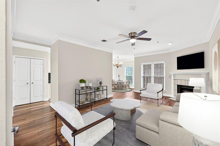This beautifully appointed 2-bedroom, 1.5-bath condo is ideally located in the heart of East Dallas in a wonderfully architected red brick building shaded by mature live oak trees. Recently installed wood floors and fresh paint throughout create a bright, move-in-ready interior. The unit features a generously sized living area anchored by a cozy fireplace, flowing into a dedicated breakfast room and a well-designed galley kitchen with ample storage. A full-size utility closet adds everyday convenience. The front patio also offers tranquil views of the community pool. The primary bedroom features its own fireplace, a large walk-in closet, and direct access to the enclosed back patio providing a private outdoor space ideal for relaxing. Additional highlights include two covered, gated parking spaces. With its thoughtful updates, functional layout, and prime East Dallas location, this condo offers comfort, charm, and exceptional value.