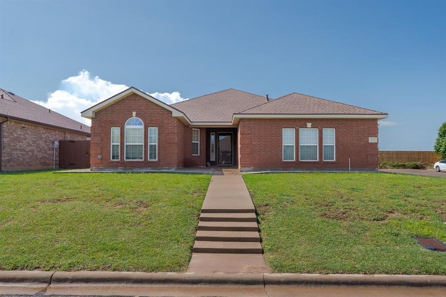Big, beautiful, brick home located in the highly sought-after Wylie School District! A perfect blend of comfort, functionality, and style! 
The kitchen is a chef’s delight, featuring rich dark cherry wood cabinets, a convenient eat-in dining area, pantry storage, and plenty of granite counter space for meal prep! Semi Open floor plan perfect for entertaining! The primary suite is a true retreat, offering a large bedroom and a spa-like ensuite complete with dual sinks, a separate shower, a large soaking tub, and a walk-in closet for all your storage needs. Need extra space? There's a flex room on the primary bedroom and can be used as a home office, gym, playroom, or an extra large 2nd closet, giving you the flexibility to suit your lifestyle. Additional updates include a new concrete sidewalk that borders the house, enhancing both the appearance and functionality. The home sits on a raised corner lot with a beautiful stained fence, an off-the-side garage for easy access, a covered patio out back with extended concrete space and irrigation in the front yard.
This house is full of thoughtful touches and located close to schools, shopping, and dining. Don’t miss your chance to own this well-maintained and stylish property—schedule your showing today!