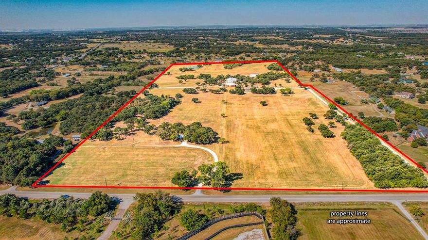 72 acres of beauty with 2 homes, multiple barns, 4 ponds located in the wonderful community of Argyle. The bulk of the land is ag exempt & located in the very desirable Argyle ISD. The expansive rectangular- shaped property includes beautiful, improved pastures, lush hardwoods, ponds & pipe fencing. This available acreage could either be a move-in ready estate or incredible residential development. The seller would consider subdividing for the right offer.