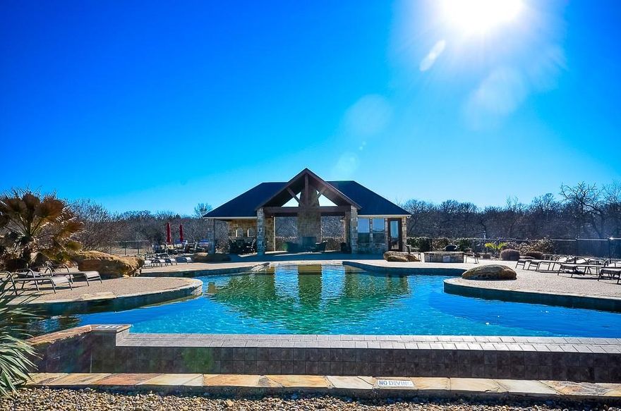 This 4 acre off water lot in Sandy Cove is huge! Located on a corner with so much room to play with, you can build that dream lake home without the waterfront price! Bordered on one side by trees & a small stream bed, with peekaboo lake views to the front & the private pool and pavilion on the other side, Lot 37 has a ton to offer! Sandy Cove is a small, private gated subdivision. Getting back to nature really is the tone here with private ponds, hiking trails & a small nature reserve it feel miles away from the hustle and bustle of the city. You won't be sacrificing the amenities you'll crave with the private pool & outdoor pavilion, grill area & the private boat ramp...just because you aren't waterfront doesn't mean you won't be able to enjoy lake! You won't even need to leave the neighborhood to do so as you are just mere steps from Richland Chambers Lake, the 3rd largest lake in Texas. It's time to come explore all that this lot has to offer & begin planning your own lakeside dream