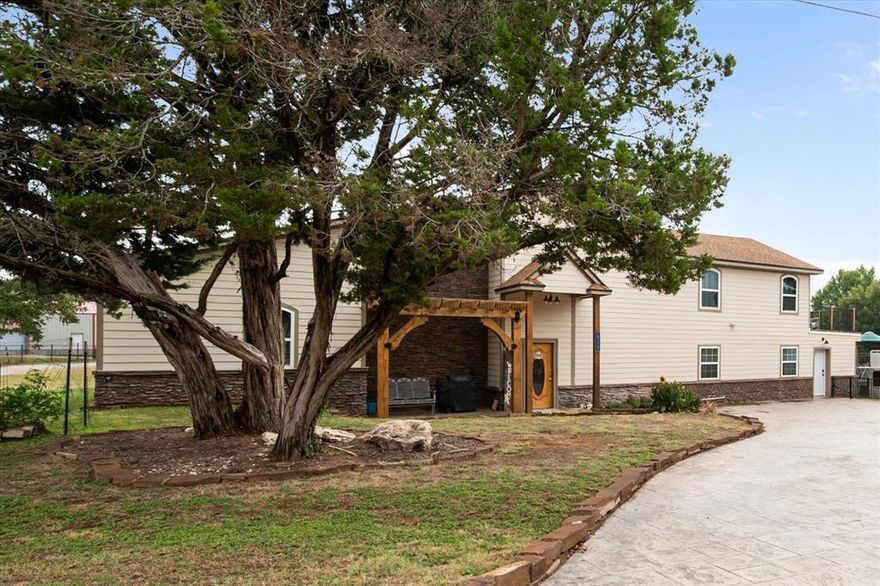 Don’t miss this stunning lakefront Granbury home with a 4-3-2 layout and a private guest apartment, ideal for a mother-in-law suite, extra living space, or rental income. Packed with modern upgrades like LED lighting, stainless steel appliances, a custom tile backsplash, walk-in pantry, granite countertops, hardwood cabinets, dry stack rock accents, rain showerheads, bamboo and tile flooring, crown molding, a utility closet with the main electrical panel, an extended stained and stamped driveway, spray foam insulation, a tankless water heater, zoned HVAC, a water manifold system, and decked attic storage. Recent updates include a new septic system and a Class 4 roof in 2022. Just a short walk to the community clubhouse, boat ramp, and pool, this home delivers lake living plus the convenience of a home office. Motivated seller, open to all offers.