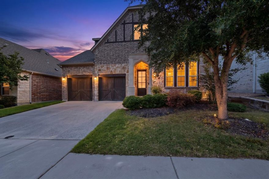 Steps from the Craig Ranch Trail - Model-Quality Ashton Woods Luxury in Frisco ISD
This Ashton Woods showpiece - same plan as the model home, over $48,870 in upgrades - delivers 3,437 sqft of curated luxury in The Trails at Craig Ranch, one of DFW's most coveted master-planned communities featuring a championship golf course, scenic parks, 100 acres of preserved green space, and resort-style amenities. Step outside to miles of scenic community trails, then minutes to LA Fitness, HUB 121 open-air entertainment and live music, Allen Premium Outlets, and Costco. A stunning Mahogany 6-lite front door sets the tone - beyond it, soaring ceilings, pre-finished hardwoods, floor-to-ceiling stone fireplace, and an open-concept kitchen featuring  granite island and perimeter, custom arabesque backsplash, 36 professional vent insert with 600 CFM blower, Whirlpool wall oven combo, Blanco undermount sink, butler's pantry, designer pendant lighting, and coordinated oil-rubbed bronze fixtures throughout. French-door study with vaulted ceiling and sunlit formal dining complete the main level. The primary suite down is a true sanctuary: tray ceiling with crown molding, freestanding soaking tub, spa-inspired frameless glass shower with River Pebble mosaic floor, dual vanities, and generous walk-in closet. Upstairs: 3 bedrooms, game room, dedicated media room ($13K structural add), beautifully crafted oak staircase with iron balusters and volute step, premium carpet throughout, and oversized laundry with upper cabinetry. Covered rear patio with brick columns and ceiling fan. Oversized 3-car tandem garage.  Frisco ISD - just a 3-min walk.
Frisco ISD  4 BD  3.1 BA  3,437 SqFt  Master Down Media Room  Study  Game Room  3-Car Tandem  Trail  Golf  LA Fitness  HUB 121  Allen Premium Outlets