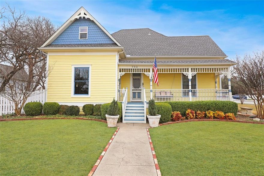 HISTORIC MCKINNEY! This lovely Victorian home sits on a corner lot framed by a classic white picket fence in the heart of Historic Downtown McKinney. Featuring four bedrooms and 2.5 baths, the home beautifully combines historic charm with updates. High ceilings, original wood floors, and natural light fill the interior, creating a welcoming feel throughout. The property also includes a detached two-car garage with a dedicated work area.

The primary bedroom is conveniently located on the first floor with ensuite bathroom, second bedroom and half bath off of the hallway.  First floor features original pine floors and the upper level features original East Texas pine flooring, as well as two bedrooms,  full bath and a versatile loft space. Original boxcar wood countertops in the kitchen add to the home’s authentic historic appeal. Farm sink, refrigerator, pantry space and door leads to back porch off of kitchen for easy access from 2 car garage.  Large driveway with plenty of room for extra parking.

Significant updates include plumbing, electrical, and kitchen improvements, along with a roof replacement approximately three years ago. Outdoor living is enhanced by both front and back porches, a side yard, firepit and a pergola—perfect for relaxing or entertaining!

A rare opportunity to own a beautifully preserved Victorian with modern comforts in one of McKinney’s most sought-after historic neighborhood.

Be sure to see the full UPDATE LIST located in MLS documents.