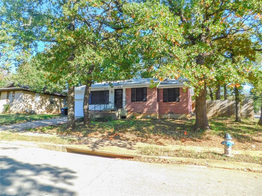 Clean three bedroom, one bath, one-story home on a corner lot. Original wood flooring in all bedrooms (and carpet in the living room). Open kitchen which includes refrigerator and microwave. Large sunroom on the back could serve several different purposes. Spacious, shady back yard. Washer & dryer also included.