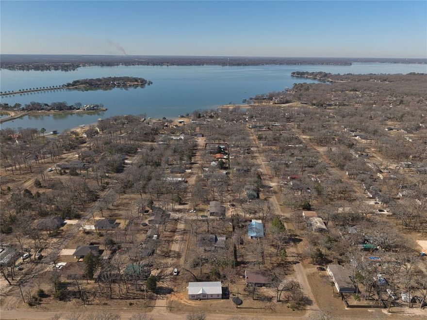 This rare opportunity features three adjoining lots totaling approximately 15,600 square feet, located just minutes from the reservoir and surrounded by a blend of established homes and active new construction. One lot includes an approximately 1,200 square foot home with a detached shop and covered back patio, creating a flexible foundation for renovation, expansion, or future redevelopment. Mature trees and a fenced setting offer a private, tucked away feel while remaining close to area growth.

The property presents strong upside for builders, investors, or buyers seeking land value in a rapidly evolving area. With multiple parcels, redevelopment or potential subdivision may be explored with proper due diligence. Properties offering this level of flexibility and location momentum are increasingly hard to find. Schedule a showing today and take advantage of this opportunity before it is gone.