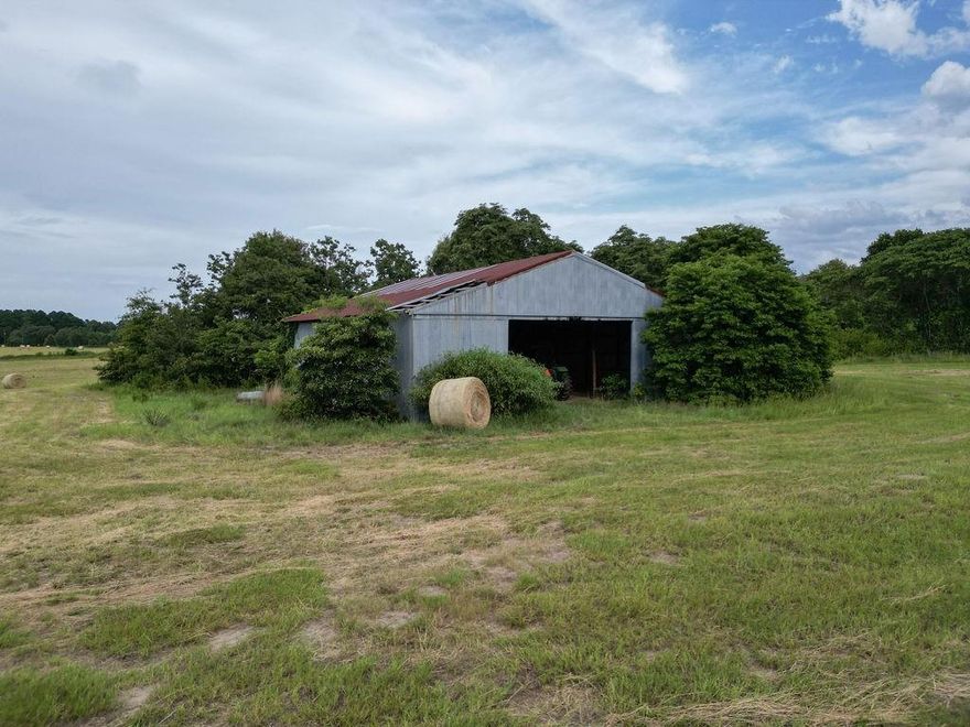 Escape to your own rural retreat with this exceptional 14+-acre Farm and Ranch property, perfectly situated in the scenic landscape of Mineola, TX. Ideal for agriculture, equestrian pursuits, or crafting your dream countryside home, this plot provides a unique opportunity to experience true country living while remaining conveniently close to town amenities. Nestled along a serene rural road, this expansive 14-acre property is graced with lush, verdant grass and matured trees outlining the perimeter, ensuring optimal privacy. The land is fully enclosed with sturdy barbwire fencing, designed to keep livestock secure and protected. A substantial hay barn stands ready to serve your storage needs, providing ample space for equipment, hay, or feed. Equipped with on-site water and electric services, the property is prepared for you to build immediately. Whether you envision a stately country residence or simple homestead, the groundwork is in place. Outdoor enthusiasts will appreciate the proximity to Lake Fork, renowned for its fishing and water activities. With quick access to major roadways, you can reach Tyler in 45 minutes or venture into the Dallas-Fort Worth Metroplex in just 1.5 hours. Located within the respected Mineola ISD and near essential services including the Wood County Airport, this property offers both convenience and high quality of life. Whether your dream is to cultivate an agricultural sanctuary, raise livestock, or build a bespoke residence surrounded by nature, this property provides the canvas for your aspirations. Embrace the peaceful lifestyle this location promises while enjoying the conveniences of nearby city life. Contact the listing agent today to schedule a private tour and explore the full potential of this beautiful farm and ranch property. Don’t miss this rare opportunity to own a piece of Texas tranquility. (Tract 2 is sold!)