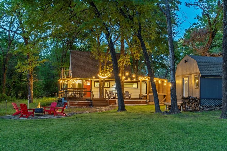 The Best Little A-Frame in Texas—Fully Renovated Waterfront Retreat on Lake Tawakoni! Don’t miss this rare opportunity to own a one-of-a-kind A-frame on Lake Tawakoni, known for premier fishing including trophy catfish, bass, and crappie. Fully renovated from top to bottom, this move-in ready lake home perfectly blends modern upgrades with classic cabin charm. The light-filled A-frame design showcases stunning lake views and an inviting, elevated feel throughout. The primary suite is conveniently located on the main level, while two upstairs bedrooms open to a private balcony, ideal for relaxing and taking in the water views. Step outside to your private outdoor oasis featuring a hot tub with privacy fencing and a fire pit area, perfect for entertaining or unwinding after a day on the lake. The oversized insulated garage offers ample storage, washer and dryer, extra refrigerator freezer, and a dedicated boat plug-in. A detached flex space adds incredible versatility, ideal for a workshop, game room, or gym. Added peace of mind comes with a whole home warranty in place through July 2029, making this property an even more attractive and secure investment. With negotiable furnishings and a proven track record as a successful Airbnb, this property is an exceptional investment. Whether you're seeking an income-producing investment, a relaxing getaway, or a place to call home full-time, this property delivers. Lakefront homes like this are hard to find and highly sought after.