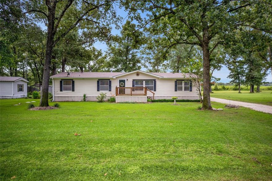 MOTIVATED SELLER WITH PRICE REDUCTION!! 

Experience Lakeside Living at its Finest: Your Dream Home Awaits Near Lake Fork!

Discover the perfect blend of comfort and country charm. Nestled on a generous half-acre lot with a fantastic walk to the shores of legendary Lake Fork, this spacious 4-bedroom, 3-bathroom home is an angler's paradise and a family's dream retreat. Peaceful setting, large trees, and plenty of wildlife.

Step inside and be greeted by an inviting atmosphere, featuring a spacious, well-appointed kitchen—the heart of the home, ready for culinary adventures. Unwind in the separate living area with a cozy electric fireplace, perfect for romantic evenings. The large master suite offers a private sanctuary for relaxation.

But the true magic extends beyond the walls! This property boasts an incredible outdoor setup. A huge workshop with covered carport and drive-in bays provides unparalleled space for vehicles, boats, projects, storage, and separate utilities, is the perfect man cave!

For those who love the outdoors, a fantastic covered wood deck and patio offer the ideal setting to enjoy the peaceful natural surroundings. And for the avid angler, a dedicated fishing cleaning area ensures your prized catches are prepped with ease. Need extra storage?  A convenient conex container is also on the property.

Lake Fork living at its best! Located just a short, pleasant golf cart ride from your doorstep to the private community boat launch, dock, and fish cleaning station. Lake Fork is renowned as the #1 Bass Fishing Lake in Texas, offering world-class fishing opportunities. Beyond fishing, Lake Fork provides a myriad of recreational activities including boating, water sports, kayaking, bird watching, and picnicking.

This is more than just a home; it's a lifestyle. Don't miss your chance to own a piece of paradise near Lake Fork. Schedule your private showing today and start living the lake life you've always dreamed of!!