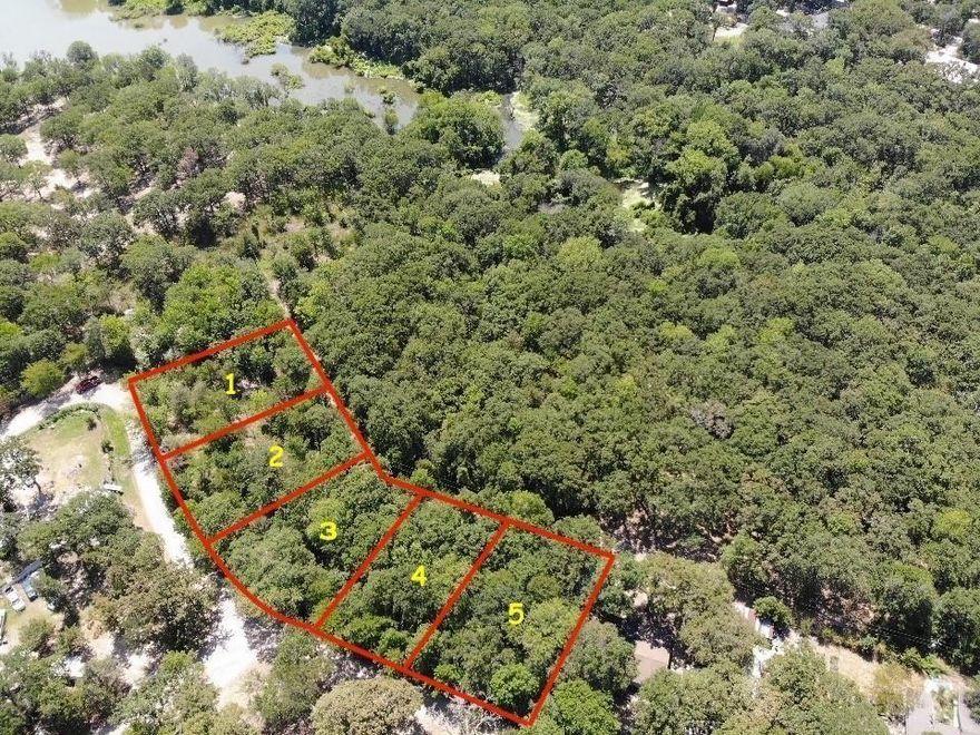 Beautiful lot with large hardwoods backing up to lake Tawakoni. Easy access to lake Tawakoni from back of property. No neighbors to rear of property make this the perfect get away, lake home or air bnb spot. No known restrictions and mobile homes allowed. Selling #5 and #4 can be sold together.