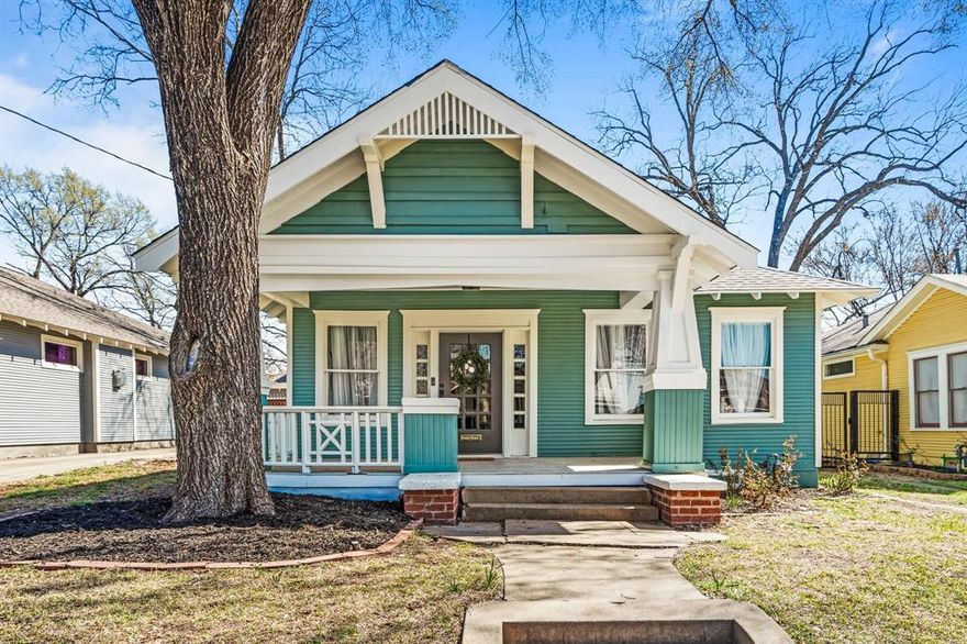 Welcome to this stunning craftsman bungalow in the heart of Junius Heights, featuring a full-length covered front porch that invites you right in. Step inside to soaring 10-foot ceilings and rich ebony wood floors that flow throughout. The dining area opens to a spacious, modern kitchen with open shelving, new appliances, and room for a small table or island. A tucked-away utility closet houses a full-size washer and dryer for added convenience.

Just off the kitchen, a charming screened-in porch offers the perfect spot to relax and enjoy the fall weather. The primary suite includes a generous en-suite bath with dual vanities. Outside, you’ll find an electric gate, a detached garage with a small workspace, and plenty of charm throughout. Completely move-in ready — this one is a must-see! Can be delivered vacant or with existing furniture.
