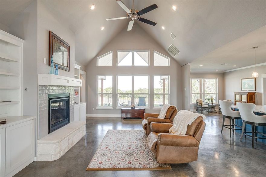 Welcome home to a 7.24 acre oasis that offers the wonderful countryside views and awesome sunrises and sunsets! This modern farmhouse is full of charm and ready for new memories to be made within the walls. You are greeted with a wrought iron fence around the home to help feel secure; a great place to hang all decorations for all seasons. Upon entering the front door, the home boast an open floor plan with stained concrete flooring, fireplace and built-in cabinets with book shelves. The kitchen host a gas cooktop range, breakfast room and kitchen island with ample counter space, cabinetry and natural lighting. The Primary bedroom is spacious and inviting with walk in closets and an ensuite with a walk in shower and garden tub for soaking. There is an additional room down stairs that can be used as an additional bedroom. Upstairs you will find two more bedrooms and a finished bonus room that can be used for just about anything you could think of; extra storage too. Come See and picture yourself owning a little piece of country living. The Last but not least, there is a storm shelter in the yard too and a hidden storage room. You'll have to schedule an appointment to see where it is!