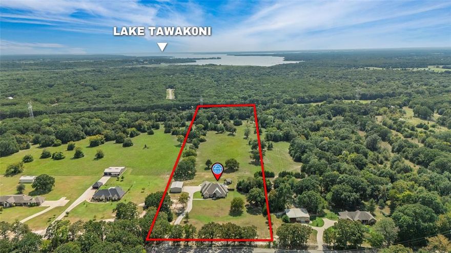Price Improvement! Welcome to 2919 County Road 3514—where luxury meets country charm on 9.64 scenic acres in one of Greenville’s most sought-after areas, just minutes from Club Lake and Lake Tawakoni. This beautifully crafted custom home offers 3,533 square feet of elevated living space, featuring 3 generously sized bedrooms (plus a potential 4th), 3 full bathrooms, and 1 half bath. From the moment you enter the open and elegant front entryway, you’re greeted by real hardwood floors that extend throughout the entire home, enhancing its warm and refined atmosphere. The chef’s kitchen is a showstopper, equipped with a built-in refrigerator, an abundance of custom cabinetry, expansive counter space, and a layout designed for entertaining. The open floor plan connects the kitchen seamlessly to the spacious living and dining areas, making it perfect for hosting gatherings or enjoying everyday life. A dedicated private office provides the perfect work-from-home setup. Entertainment lovers will appreciate the fully loaded media room—complete with a $20,000 projector and surround sound system—as well as its own full bathroom, offering a true cinematic experience without leaving home. Step outside to your private oasis featuring a resort-style pool, a covered outdoor kitchen, and a spacious entertaining area ideal for weekend barbecues or peaceful evenings under the stars. A large shop with electricity and a half bath provides endless possibilities for hobbies, storage, or workspace. The long private driveway leads you past wide-open views and peaceful surroundings, with the back 7 acres currently ag-exempt and used for hay production. You’ll enjoy all the peace of living in the country while still being conveniently close to town for groceries, dining, shopping, and L3 Harris. Located in the desirable Lone Oak ISD, this home is the perfect blend of comfort, convenience, and countryside tranquility—an absolute must-see! Motivated Seller so bring all offers!