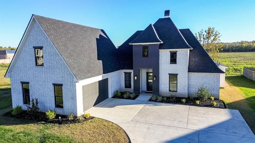 Experience refined luxury in this brand-new home located in the highly sought-after Duckwater Landing subdivision of Bossier City. Thoughtfully crafted by a skilled builder and interior designer, this residence showcases exceptional craftsmanship, intentional design, and timeless elegance throughout.

The open-concept floor plan is highlighted by wide-plank white oak wood flooring and custom stained white oak cabinetry, creating warmth and sophistication in every space. The chef’s kitchen is a true showstopper, featuring a striking quartzite waterfall island, matching countertops, and a full-height quartzite backsplash—designed for both everyday living and elevated entertaining.

Expansive windows and designer lighting fill the home with natural light, enhancing the inviting atmosphere. Enjoy a breakfast room with serene country views, along with a formal dining space anchored by a stunning statement chandelier. The primary suite offers a spa-like retreat with elegant finishes, a soaking tub, and a luxurious chandelier (To be installed)—perfect for unwinding in style.

Outdoors, a fully equipped outdoor kitchen provides the ideal setting for gatherings, al fresco dining, or peaceful evenings at home. This home seamlessly blends indoor elegance with exceptional outdoor living, setting a new standard for luxury in Bossier City.

Schedule your private showing today through BrokerBay or contact the Listing Agent directly.