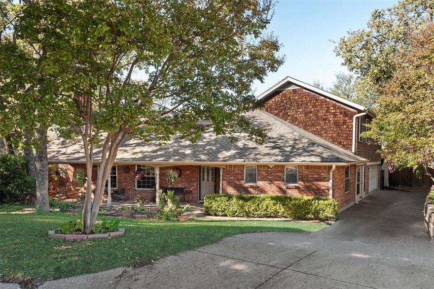Welcome to this beautiful, well-maintained North Arlington home nestled in an established neighborhood and zoned for Butler Elementary. Located on a  cul-de-sac, the home offers instant curb appeal with its expansive, inviting covered front porch. Step inside to find well-crafted crown molding in the entryway and gorgeous wood floors flowing through the living and dining rooms. The cozy living room features a charming fireplace, ample seating space, and an easy flow into the dining area and spacious kitchen. The kitchen includes a unique faux fireplace and opens directly to the backyard.
The large primary bedroom boasts vaulted ceilings, elegant crown molding, a generous walk-in closet, and a relaxing jetted tub in the ensuite bath. A second downstairs bedroom with its own attached bathroom provides convenience and flexibility. Renovated in 2025, the upstairs offers two additional bedrooms connected by a Jack-and-Jill bathroom with dual sinks, two sizable walk-in closets, and full-length mirrors—an ideal retreat for kids. Storage is abundant throughout the home, including a hallway leading to the garage with a half bath and a separate laundry room, thoughtfully tucked away from main living areas. The backyard is a private oasis featuring a refreshing pool shaded by mature trees—perfect for hot Texas summers. There’s plenty of patio space for seating and BBQs, plus a shed for yard equipment or extra storage. As an added bonus, the roof is only five years old. This charming property blends comfort, style, and functionality—ready to welcome you home.