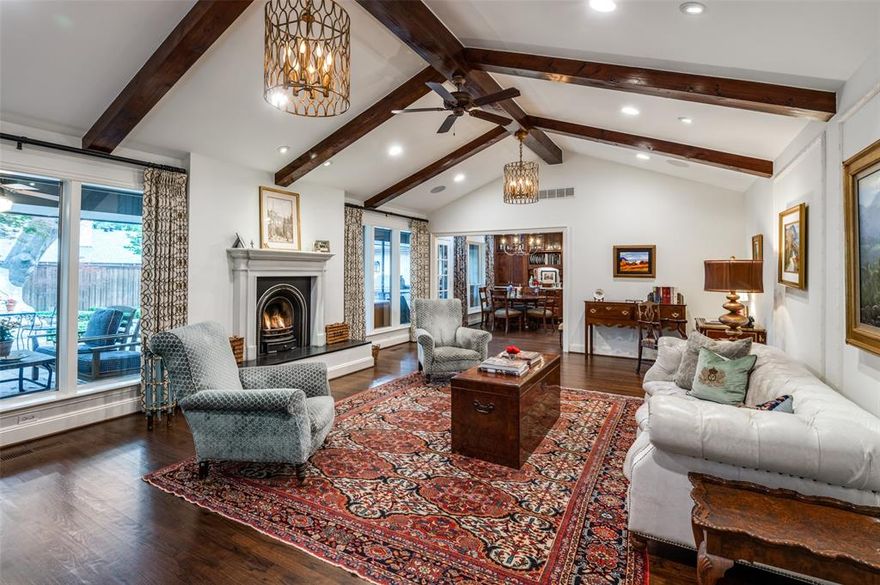 Nestled in the prestigious Russwood Acres of Dallas you will find this newly refreshed remodeled home with European details from the German-style Masonry smear façade to the English boxwood gardens. This 4 Bedroom, 3.1 Bath offers 3 Living, 2 Dining w- beautiful hardwoods, museum finished walls, elegant Kuiken Brothers moldings, paneling & vaulted beamed ceilings.  Quartzite Kitchen w- Shaws farm sink, Ann Sachs tile, Sub-Zero, GE Monogram appliances & Breakfast. Generous Living w- British marble gas fireplace, built-ins & overlooks manicured, fenced entertainer's backyard w- mature trees, French limestone fountain, outdoor bar, Hestan & Komodo grills. Spacious Primary Suite w- sitting, walk-in closets, marble Bath w- Waterworks tub, shower & double vanities, English finishes, towel warmer. Gracious Guests & abundant storage. Expansive mesquite-floored Game Room, wood-burning fireplace & wine storage. Attached Garage & 325 SF Bonus (ADU) for workshop, office, gym or 3rd Garage space!