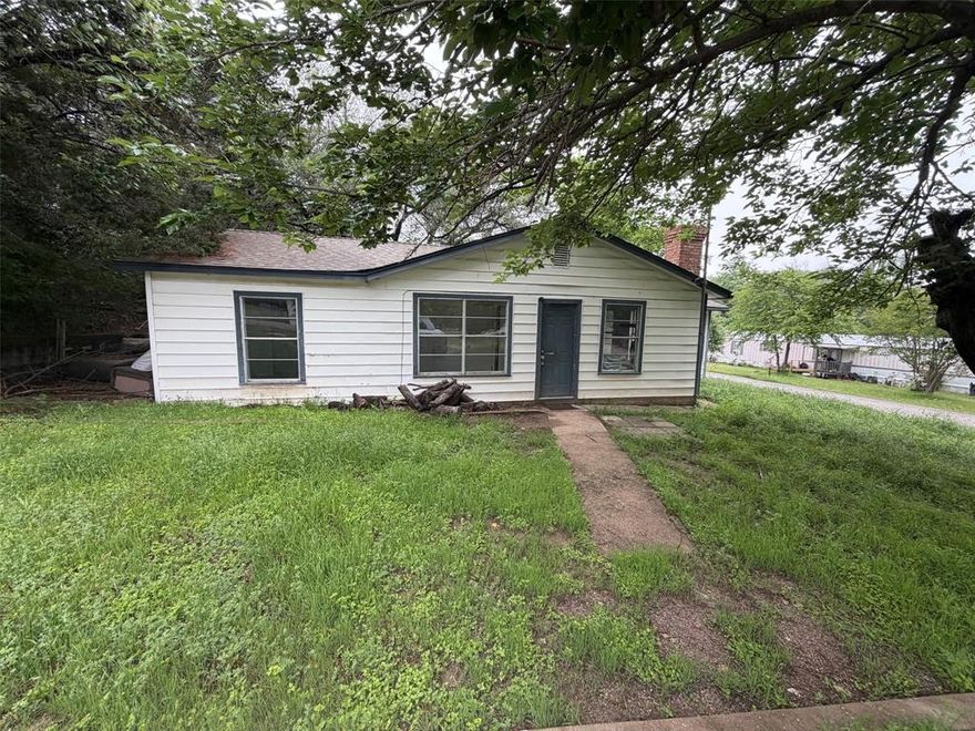 Affordable opportunity in Oak Trail Shores! This 2-bedroom, 1 and a half bath home sits on two combined lots in an established lake community with low annual HOA dues and access to community amenities. The open living area features tile flooring, a brick fireplace, and a ceiling fan, with plenty of natural light from large windows. The eat-in kitchen offers good cabinet space and a stainless range. A 2nd living area, with a layout that is functional and efficient. The property is vacant and ready for its next chapter, whether as a primary residence, weekend retreat, or investment-rental. Call today for a tour!