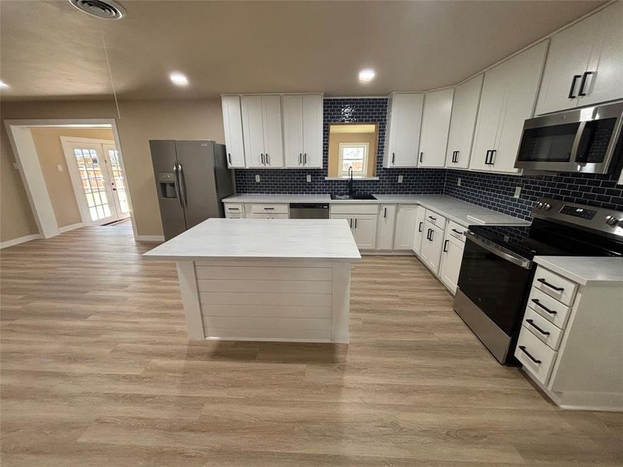 Welcome to this completely renovated 4-bedroom, 2-bath home with 2 spacious living areas and 1,942 sq ft of beautifully updated living space in Fort Worth. This move-in ready, turnkey home has been upgraded, offering modern style, functionality, and peace of mind. Step inside to an open, inviting layout featuring new flooring, fresh interior paint, updated lighting, and modern ceiling fans throughout. The two living areas provide flexible space for entertaining, a game room, media room, or home office—perfect for today’s lifestyle. The stunning kitchen is the heart of the home, showcasing brand-new cabinets, sleek countertops, stainless steel appliances, and a center island, ideal for cooking, gathering, and entertaining. The kitchen flows seamlessly into a dining area, creating a functional open-concept feel.
Both bathrooms have been fully updated with new vanities, tile, fixtures, and modern finishes, delivering a clean and contemporary look. Step outside to your private backyard deck just off the kitchen, perfect for morning coffee, grilling, or relaxing evenings. With 4 bedrooms, 2 full baths, 2 living areas, and nearly 2,000 sq ft, this home checks every box.

Turnkey • Fully Renovated • Open Concept • Kitchen Island • 2 Living Areas • Outdoor Deck • Foundation Warranty • Move-In Ready

Pro Pics with Aerials are forthcoming
Schedule your showing today!